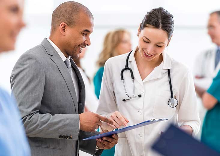 nurse talking with healthcare administrator