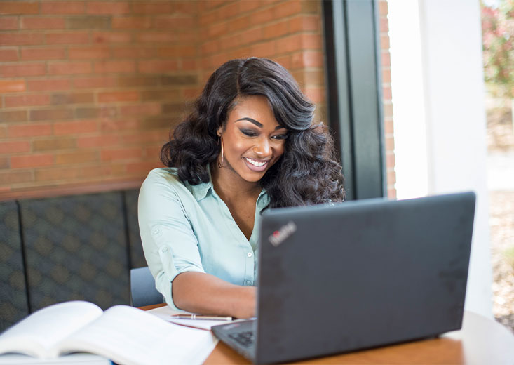 woman at cafe on laptop