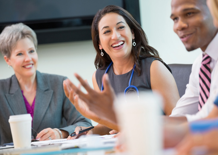 health care administration meeting at conference table with board members