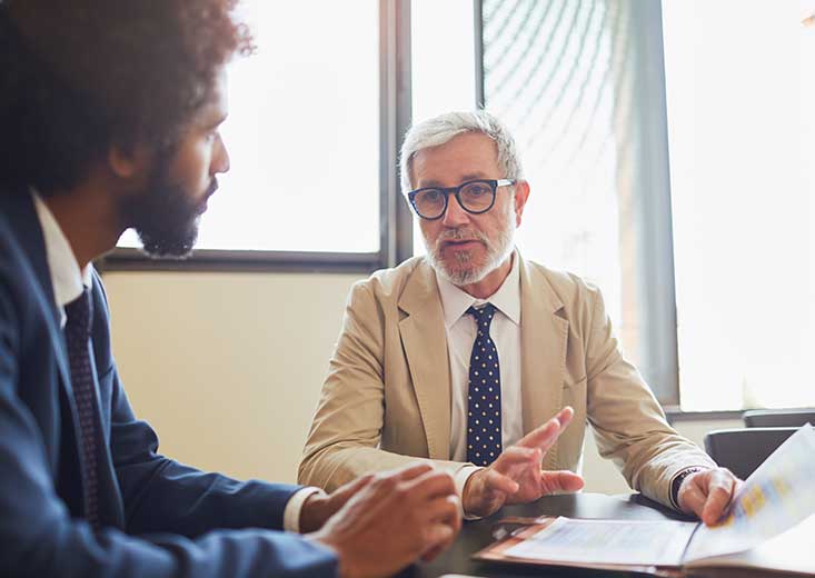 accountant reviewing paperwork with client