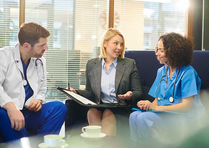 nurses talking to healthcare administrator